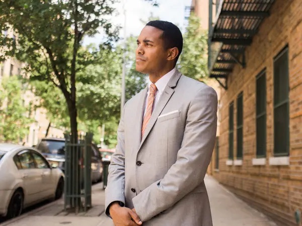Ritchie Torres standing on a Bronx sidewalk